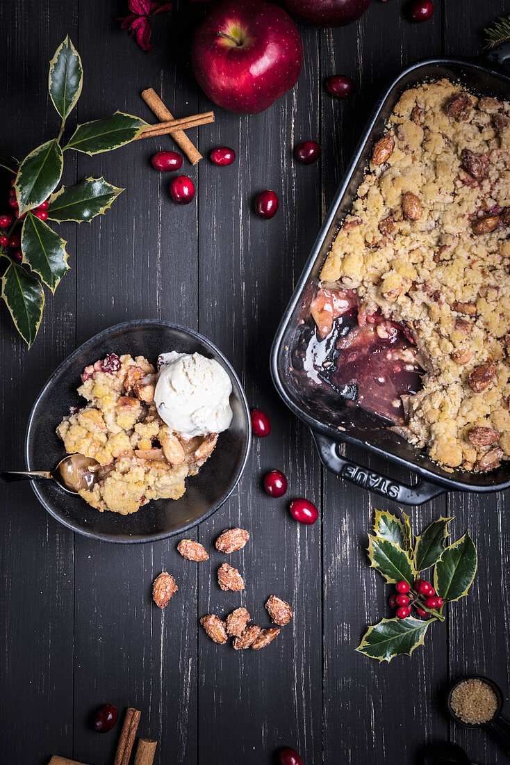 Christmas crumble with roasted almonds and ice cream (seen from above)