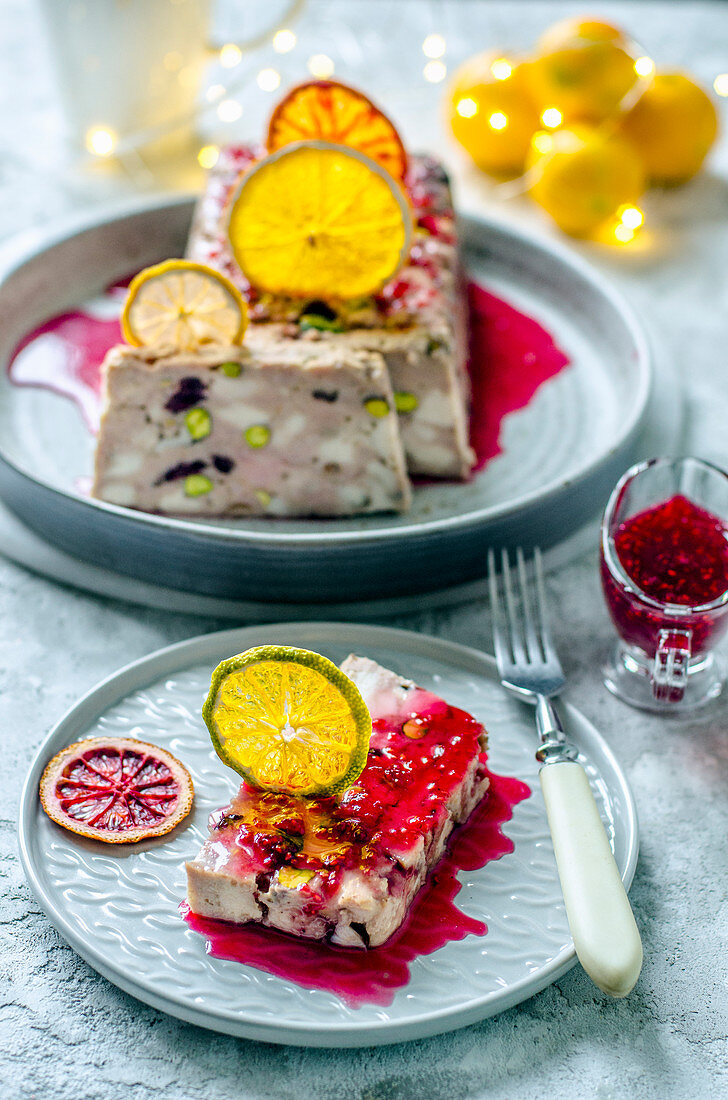 Pork and chicken terrine with pistachios, cranberries, citrus chips and raspberry sauсe