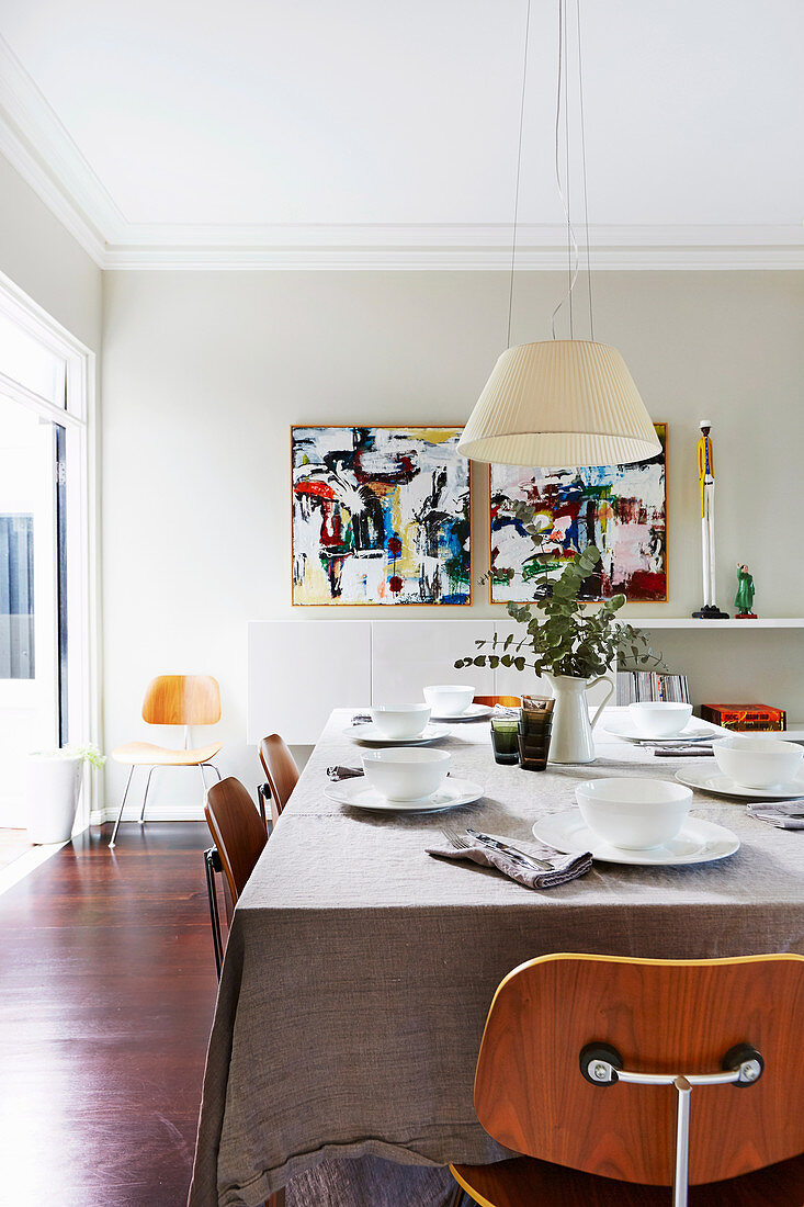 Laid dining table with classic chairs