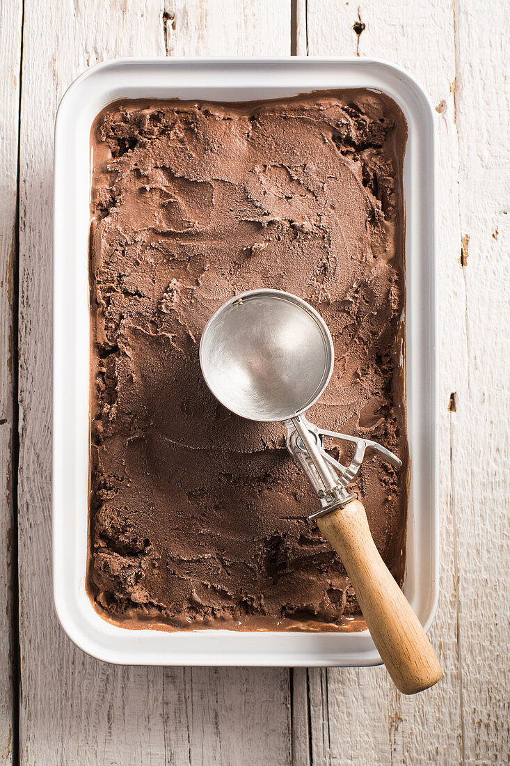Chocolate ice cream with an ice cream scoop