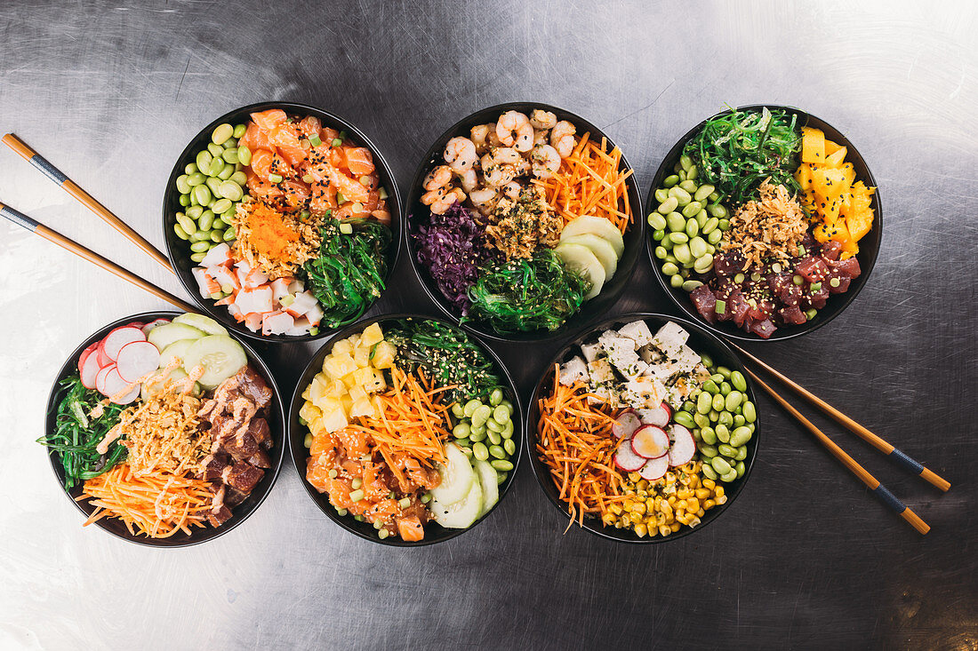 Six different poke bowls (seen from above)