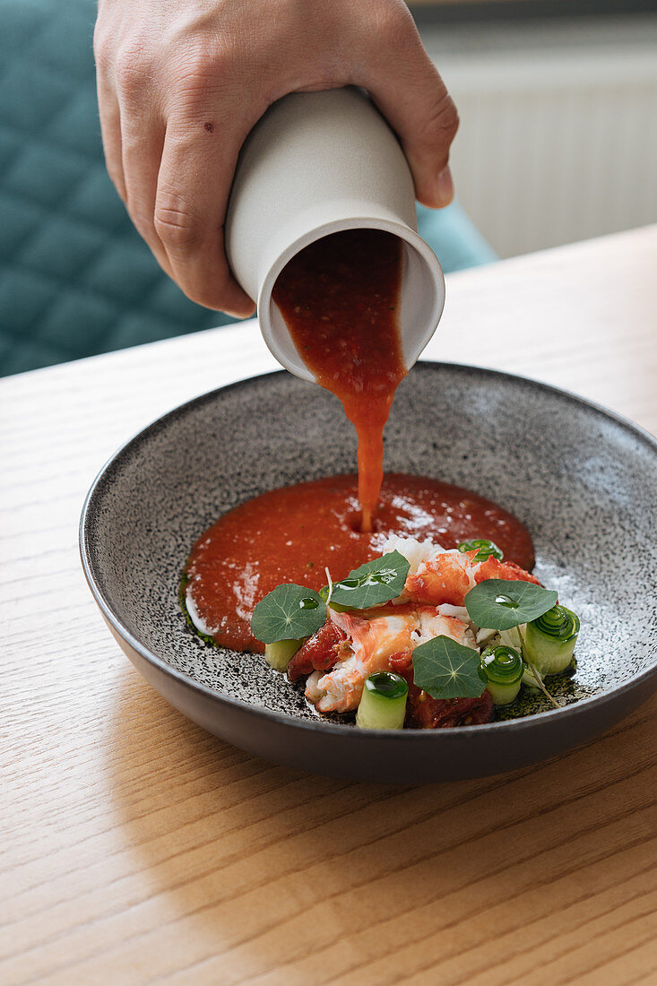 Seafood salad with water cress served with red sauce