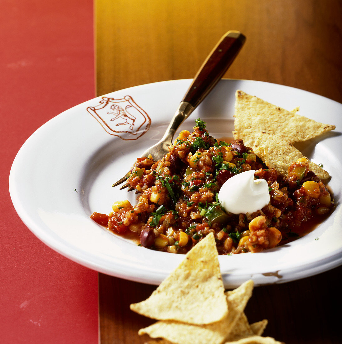 Vegetarian chili con carne made with green corn and tortilla chips