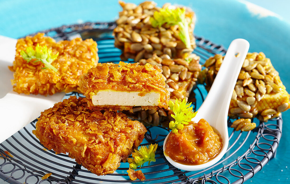 Breaded tofu snacks with cornflakes and sunflower seeds