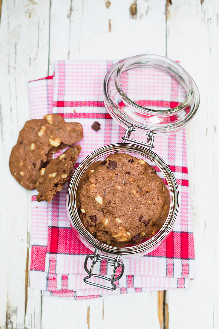 Chocolate cashew cookies in a glass jar