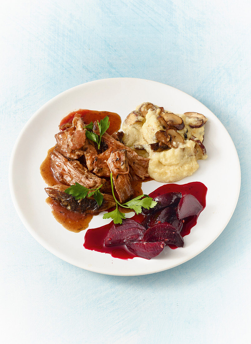 Pulled pork 'wild style' with mushroom polenta and beetroot