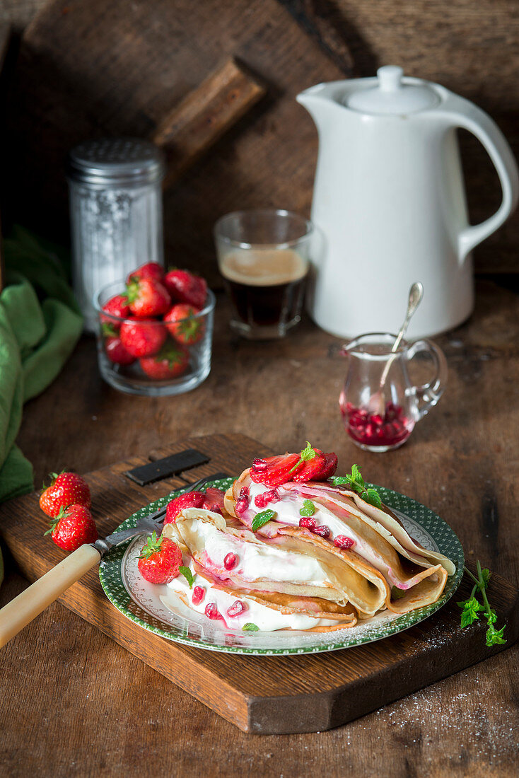 Crepes with strawberries and sour cream