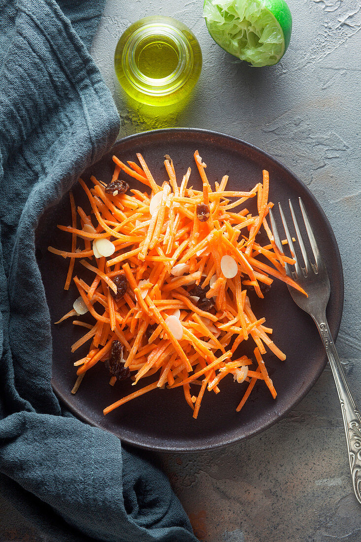 Carrot salad with raisins and almonds (top view)