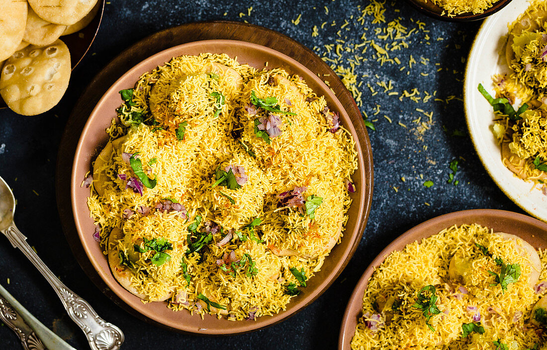 Sev puri (Indian snack made form potatoes, onions and chutney)