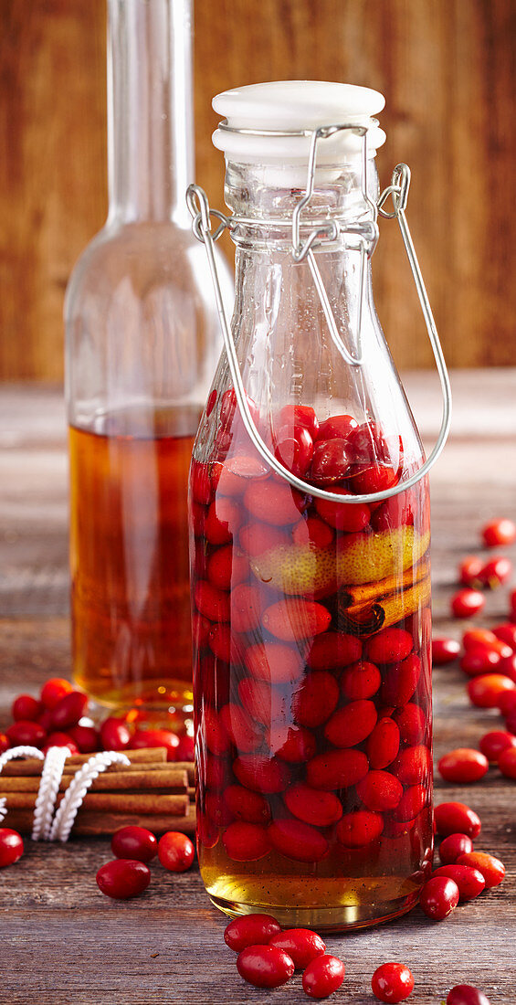 Cornelian cherries, in rum with cinnamon and lemon zest, in a bottle