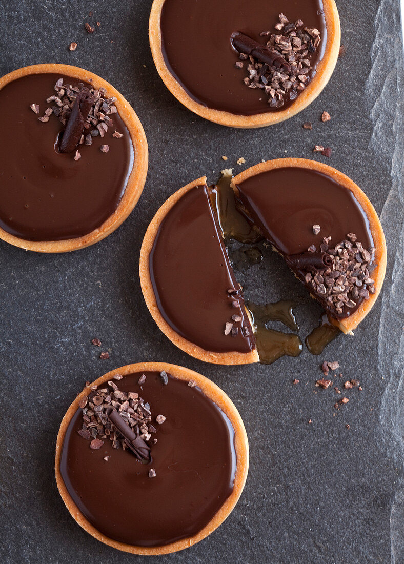 Four caramel chocolate tarts