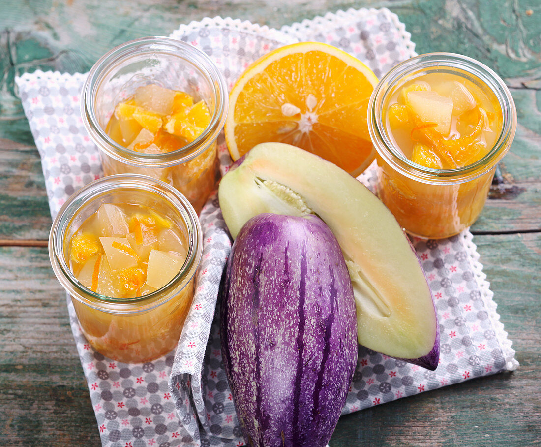 Pickled sweet and sour pepino melons with oranges, sugar and fruit vinegar