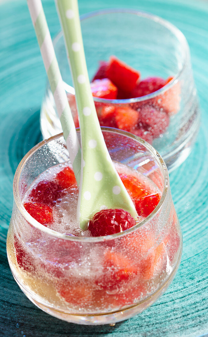 Non-alcoholic fruit punch with ginger ale, strawberries and raspberries