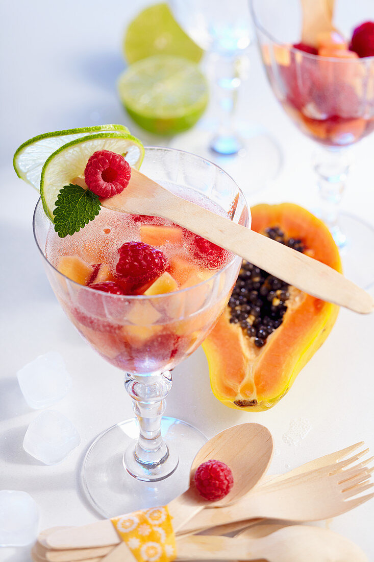 Non-alcoholic papaya and raspberry punch in glasses