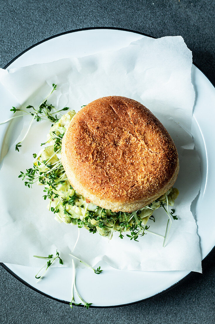 An English muffin with avocado-and-egg salad and cress
