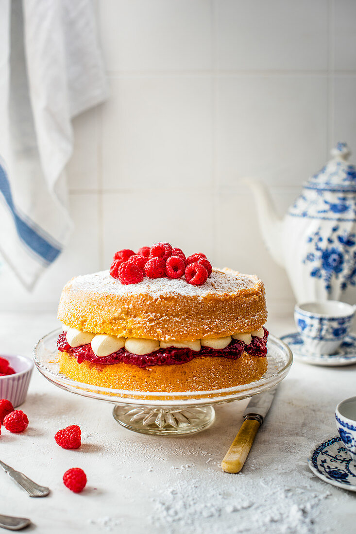Victoria sponge with buttercream icing, raspberry jam and fresh raspberries