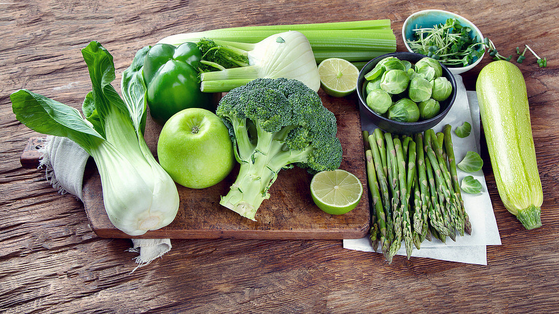 An arrangement of fresh green vegetables and fruit