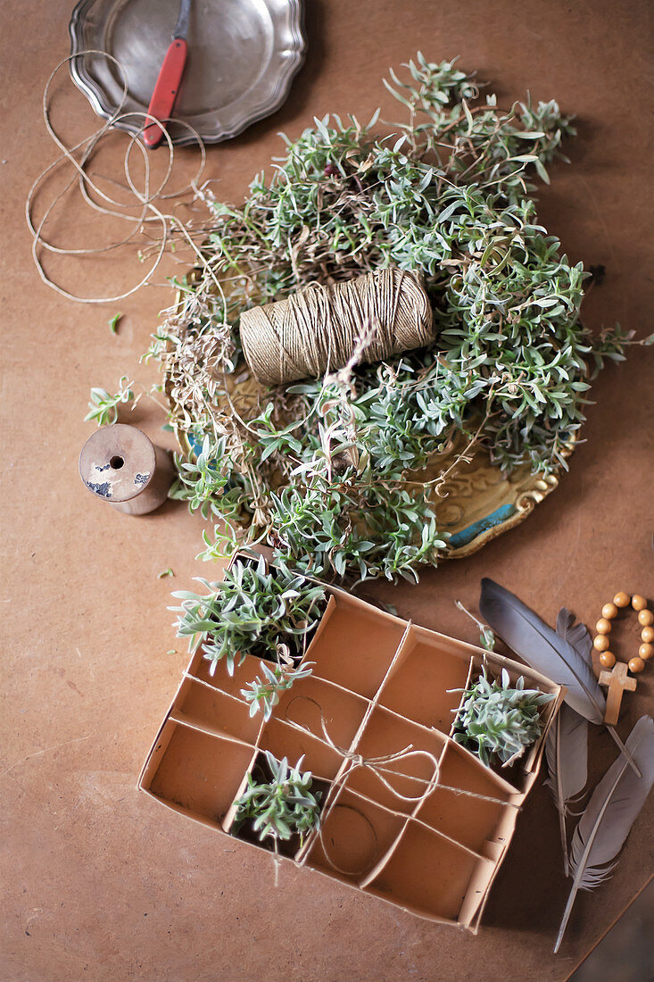 Handmade chickweed Easter nest with twine, egg box and feathers