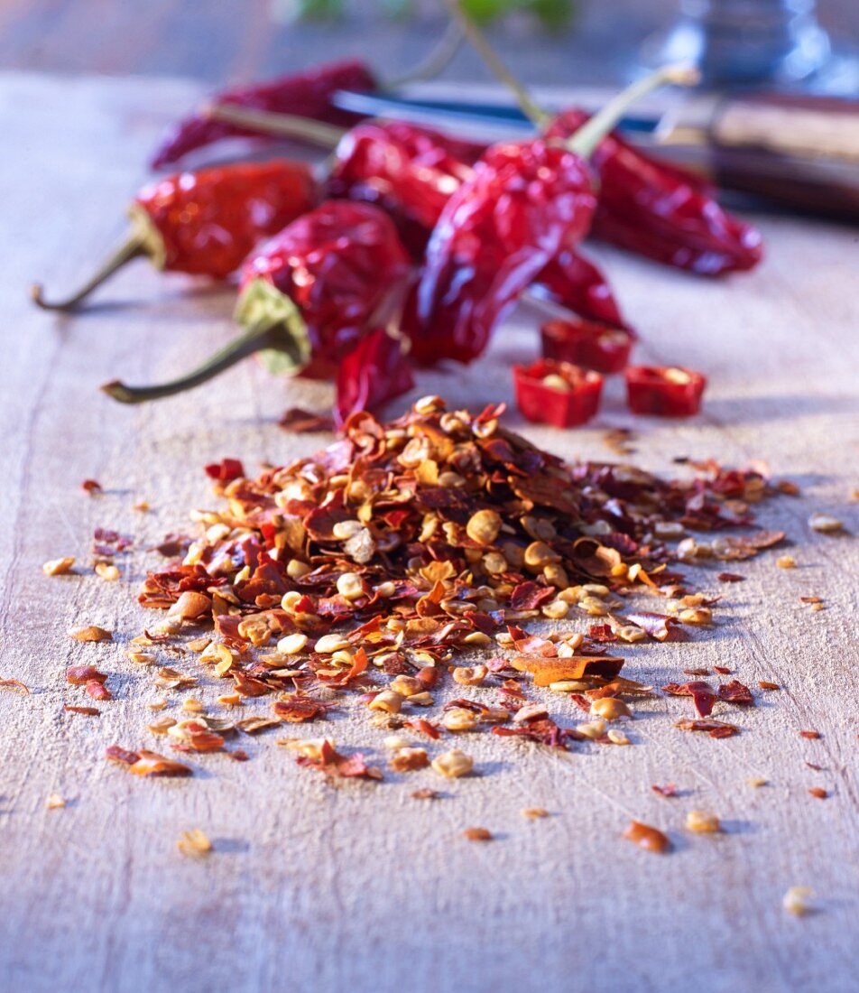 Crushed chillies on a wooden board