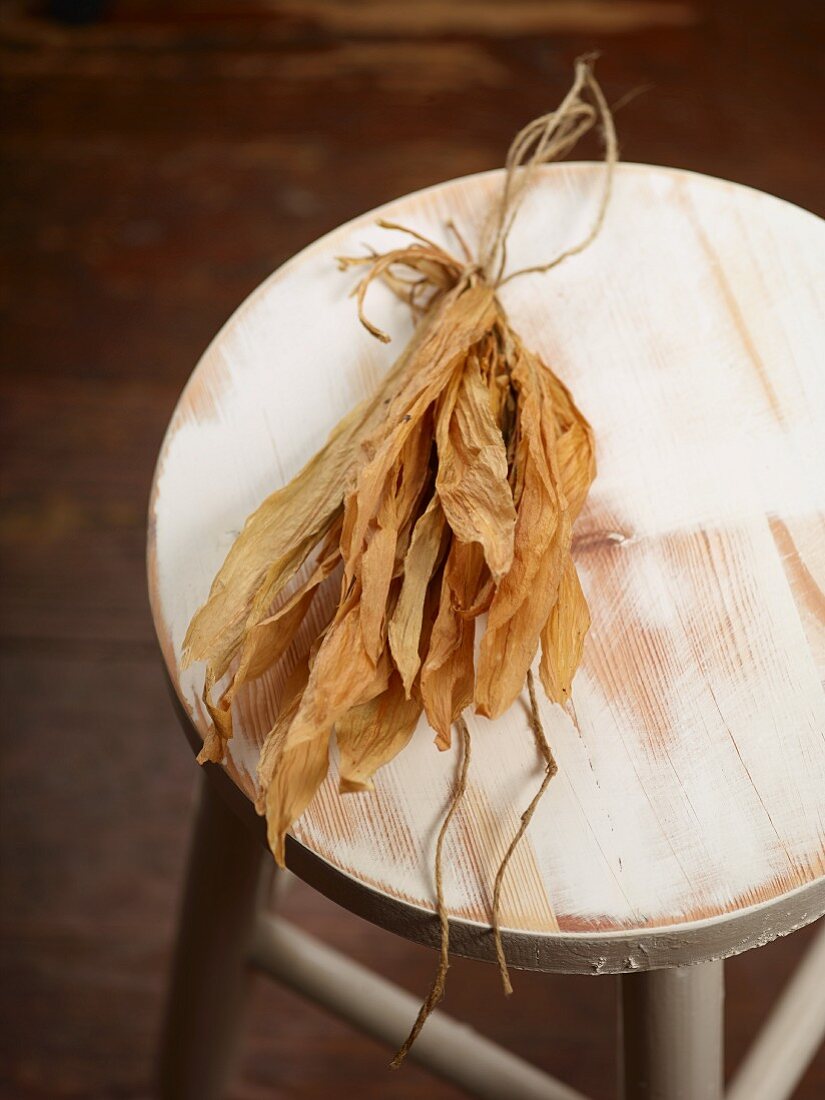 Dried wild garlic leaves on a wooden chair