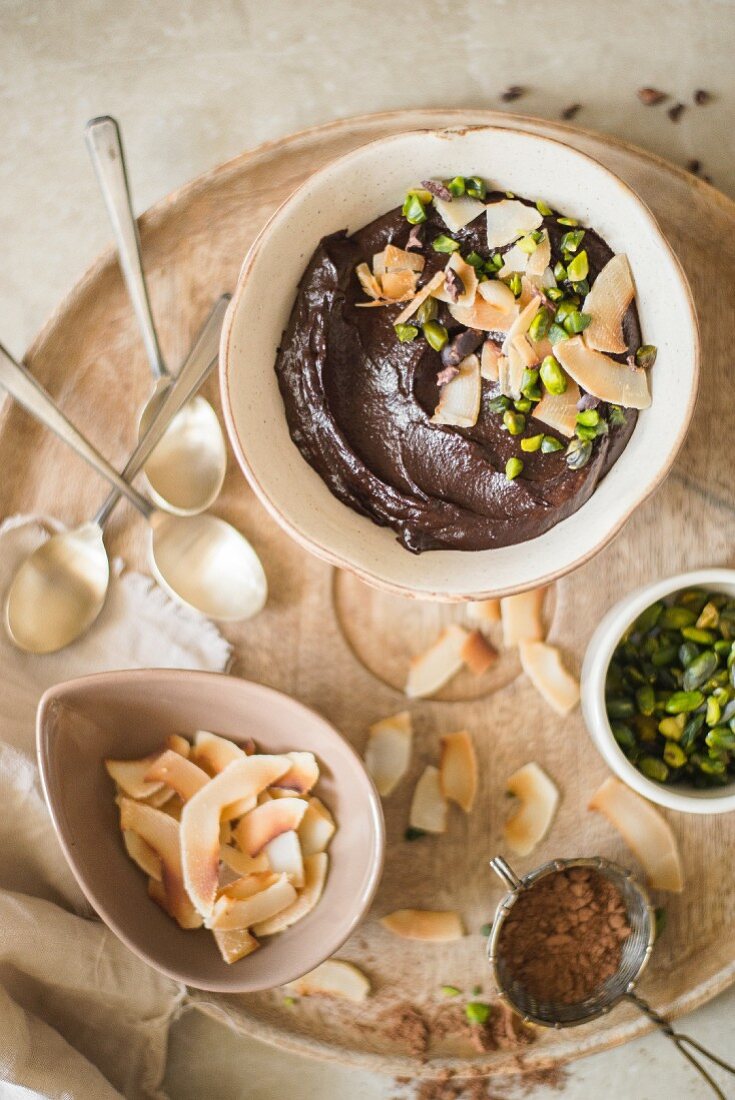 Avocado chocolate mousse with coconut and pistachios