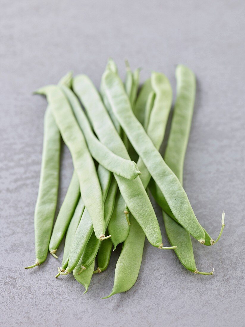 Green beans on a grey background