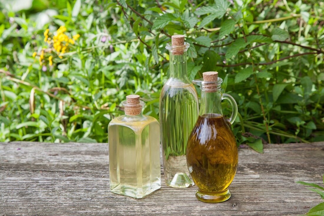 Various homemade herbal oils in bottles