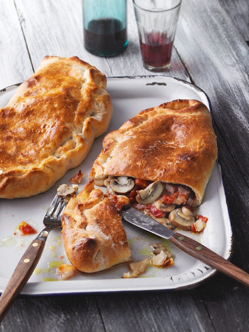 Calzone filled with mushrooms and cooked ham