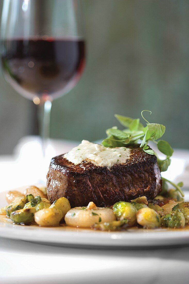 Grilled Certified Angus Beef Tenderloin with Maytag Blue Cheese Butter and Ragout of Brussels Sprouts