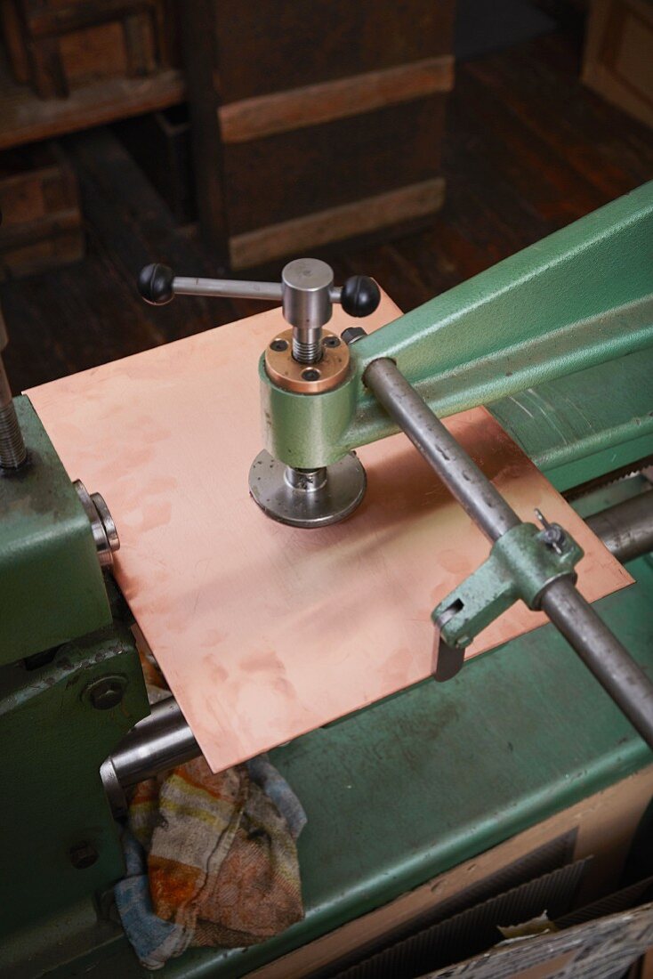 Copper sheet being cut at the Weyersberg copper factory in Baden-Wuerttemberg, Germany