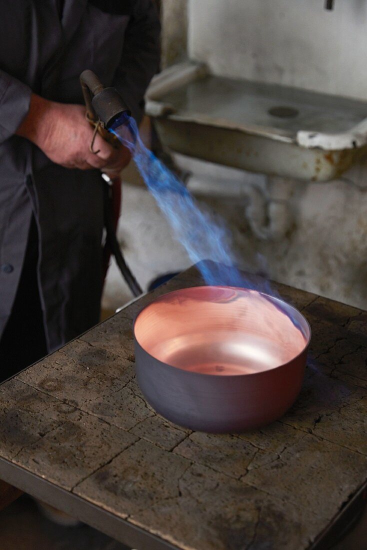 Copper sheet being heated at the Kupfermanufaktur Weyersberg copper factory in Baden-Württemberg, Germany