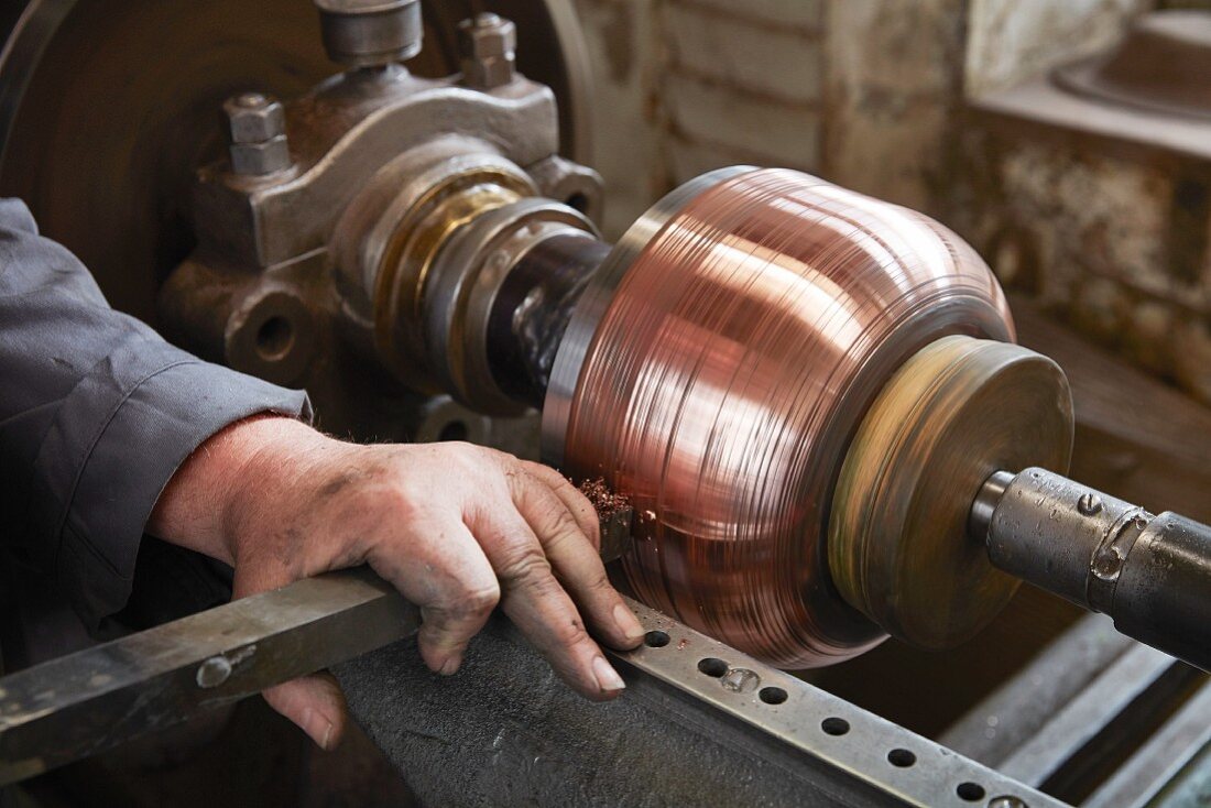 Copper sheet being sanded down at the Kupfermanufaktur Weyersberg copper factory in Baden-Württemberg, Germany