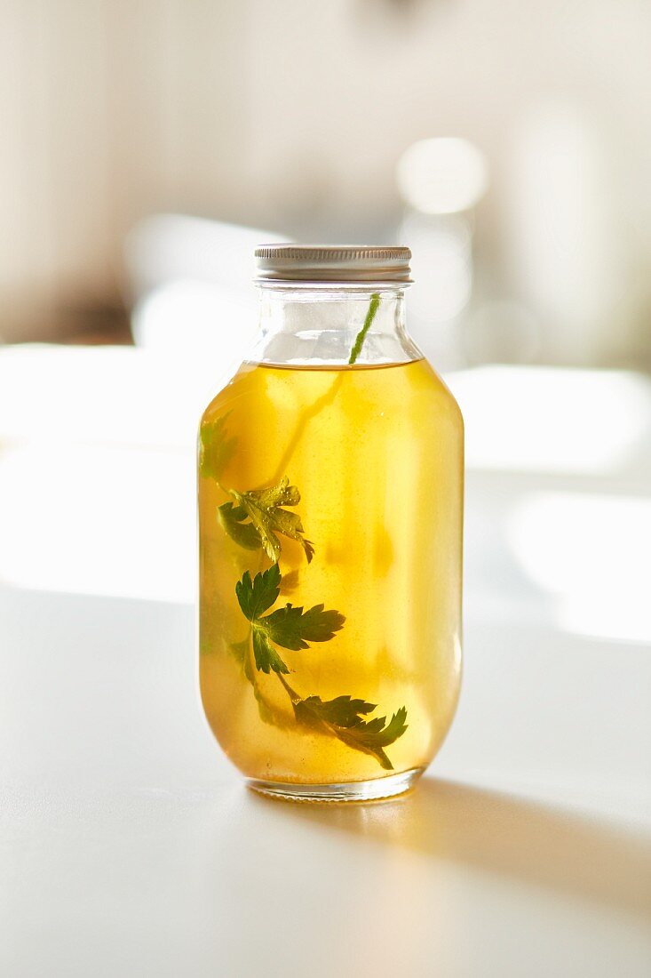 A jar of clear vegetable broth