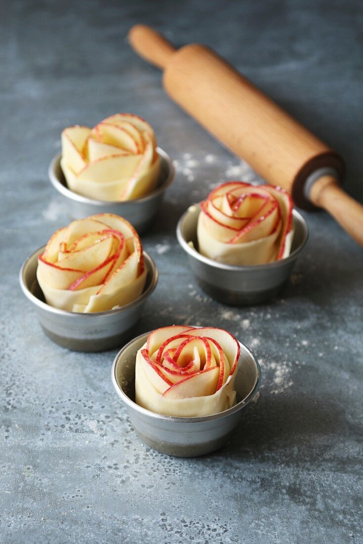 Apple rose pies in aluminium pan before baking