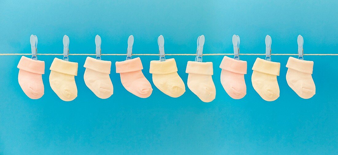 Baby socks hanging on washing line