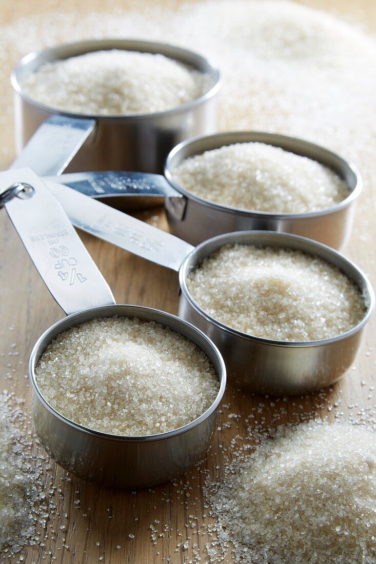 Measuring cups with sugar