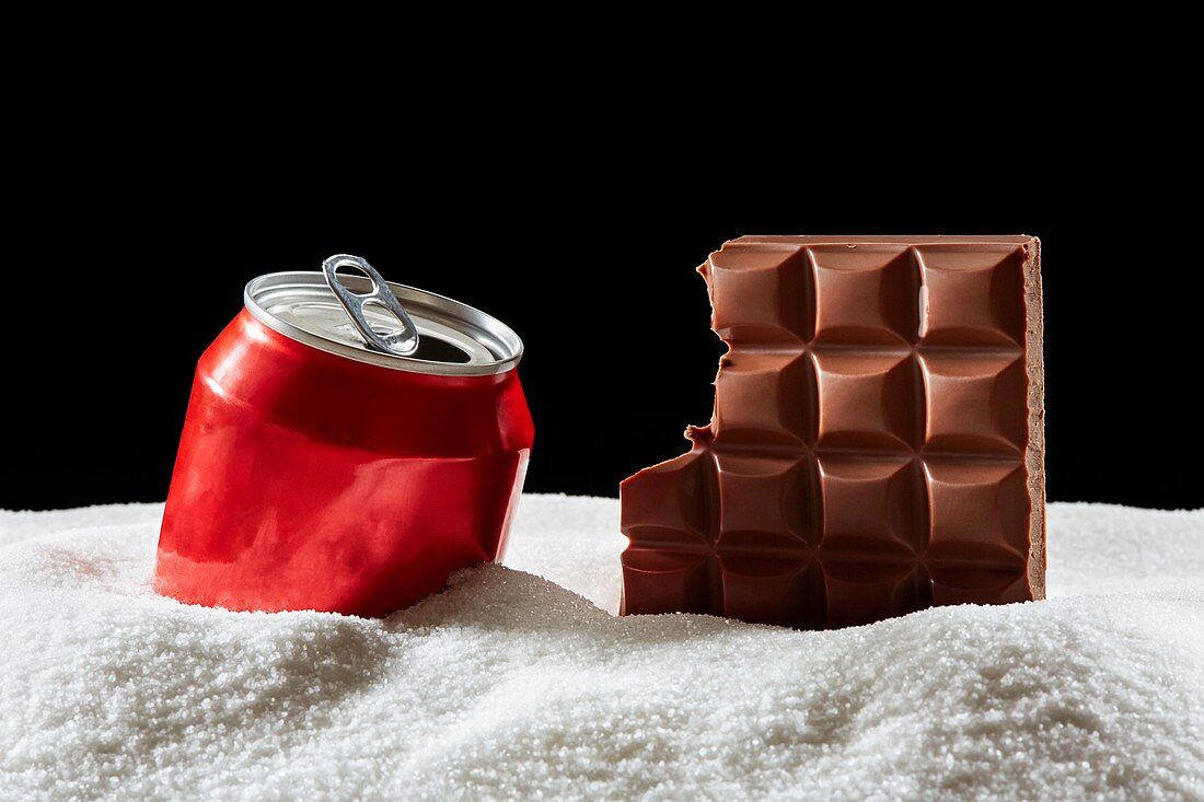 Bar of chocolate, drinks can and sugar