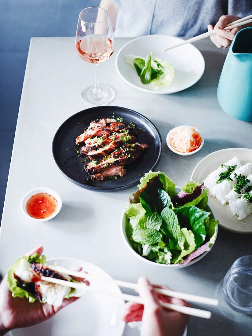 Pork neck with herbs and banh hoi noodles