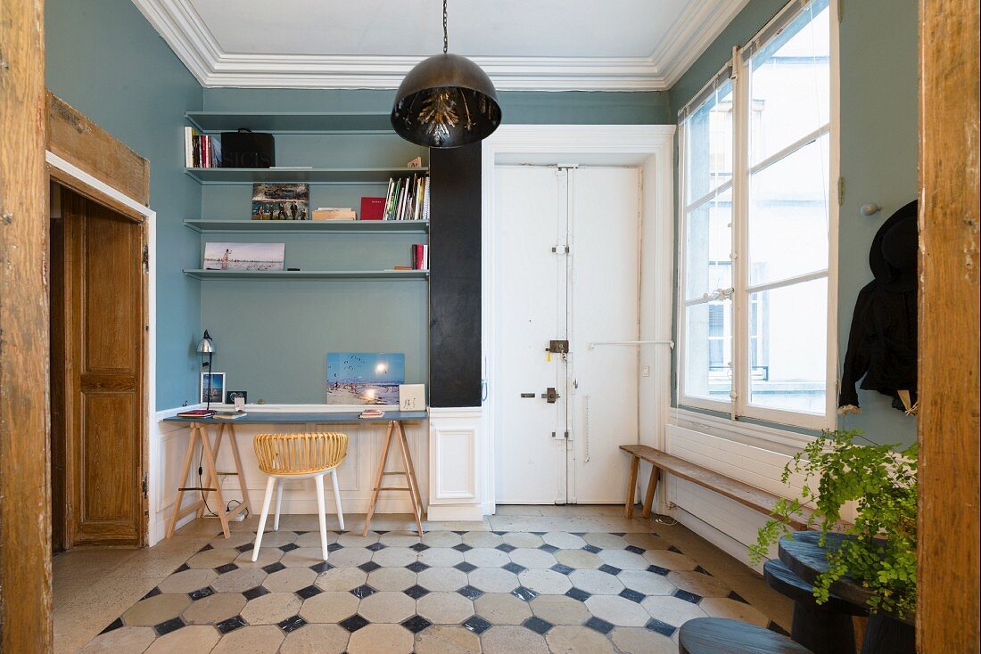 Workspace in foyer with patterned tiled floor