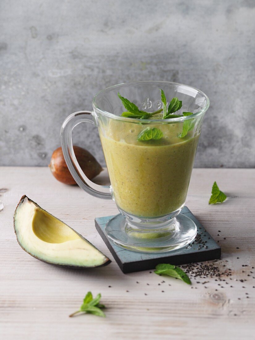 Avocado and mint green smoothie with chia seeds and coconut water