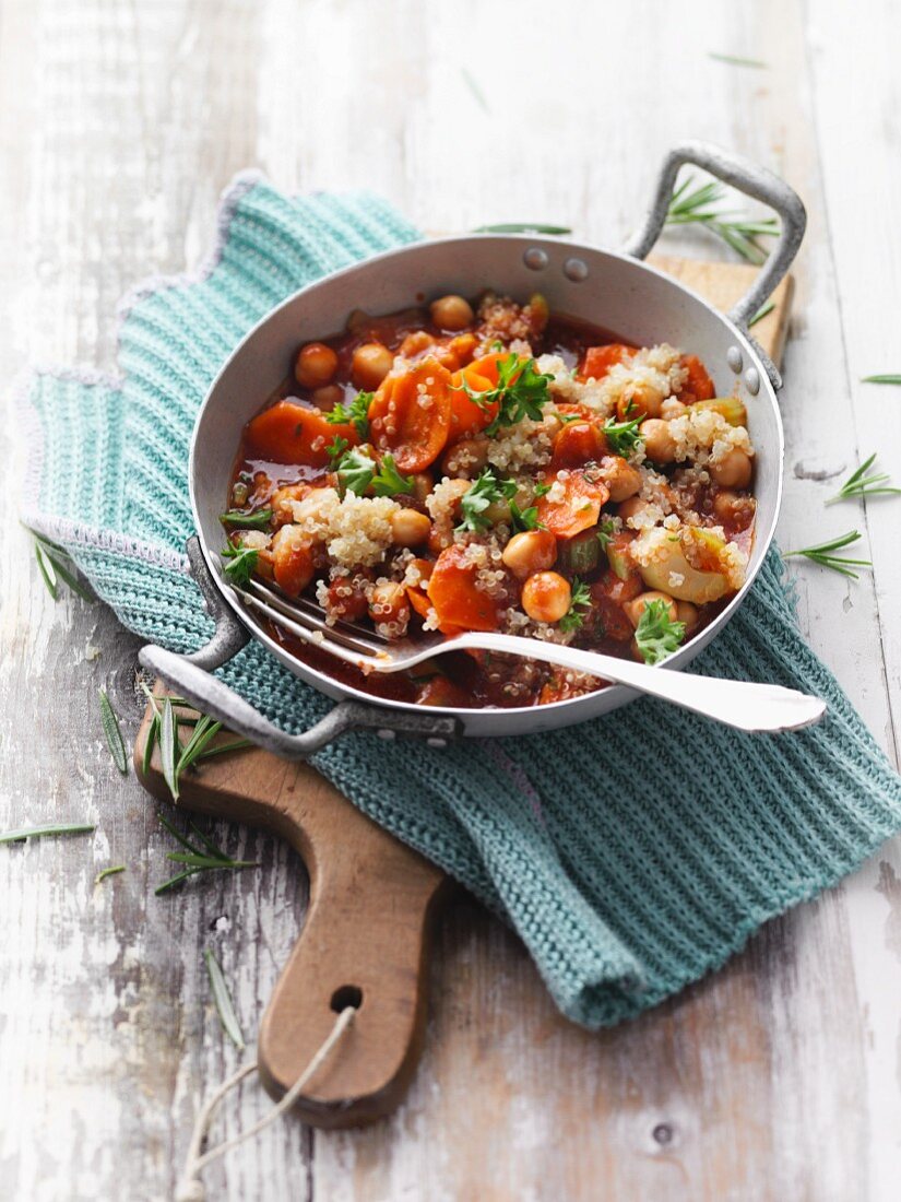 Quinoa and chickpea dish with vegetables served in a pan