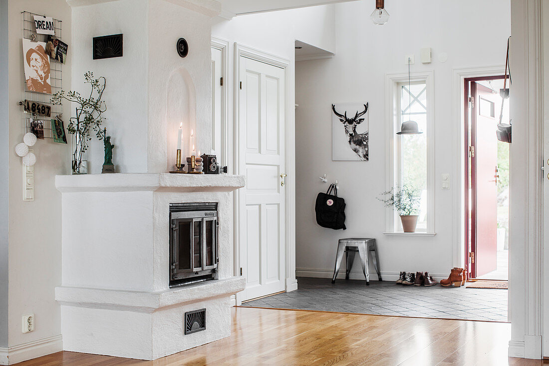 Masonry stove in bright foyer