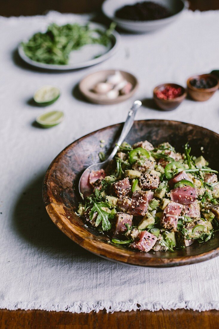 A wooden bowl of sesame seared and crusted tuna salad