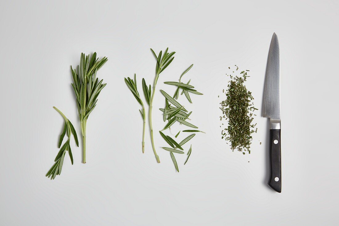 Rosemary being chopped (step by step)
