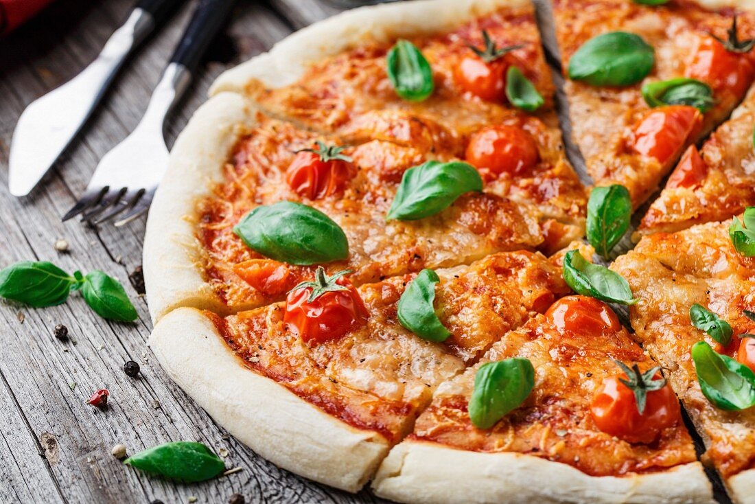 Italian pizza Margherita on a wooden table