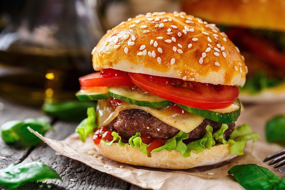 Beef burger with cheese, tomato and cucumber