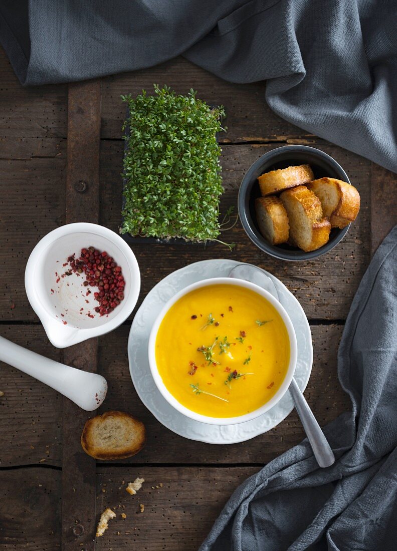 Vegan carrot soup with cress and red pepper