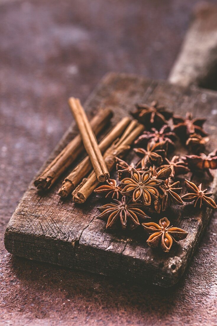 Star anise and cinnamon on a wooden board