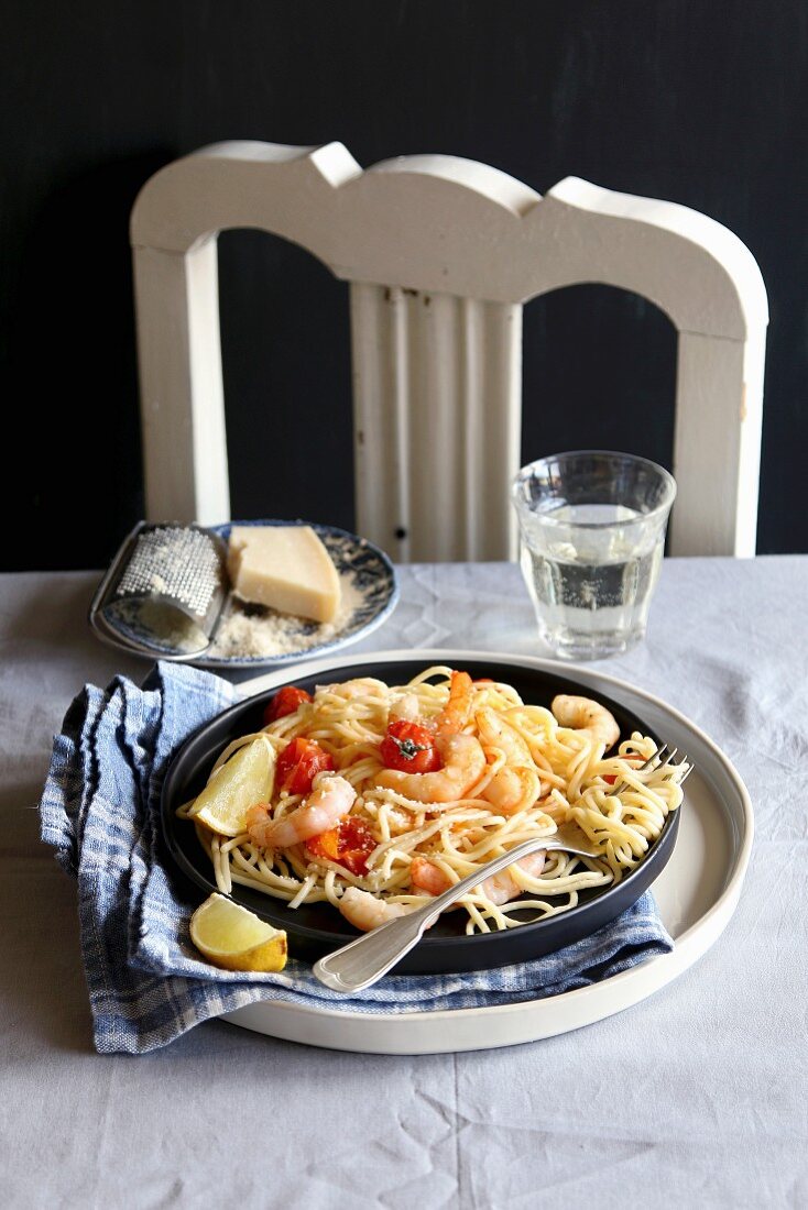 Spaghetti with shrimps, roasted tomatoes and parmesan cheese