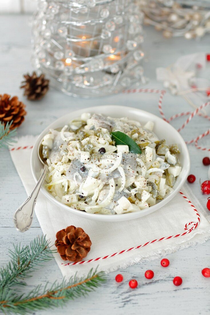 Herring with onions and apples in sour cream
